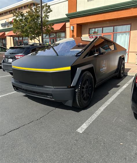 Yellow front lightbar on satin black Cybertruck | Tesla Cybertruck Forum - Cybertruck Owners Club
