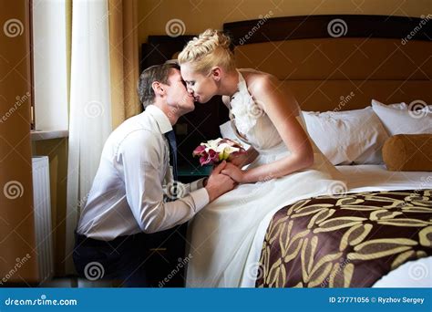 Romantic Kiss Bride and Groom in Bedroom Stock Photo - Image of ...