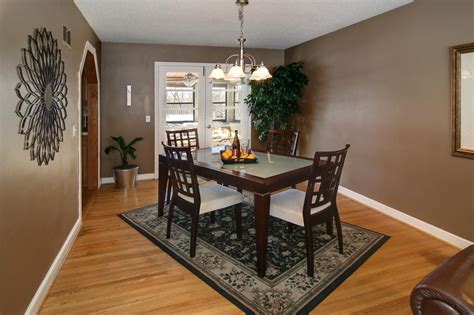 Dining Room. Brown Laminate Flooring With Elegance Dining Room Rugs And ...