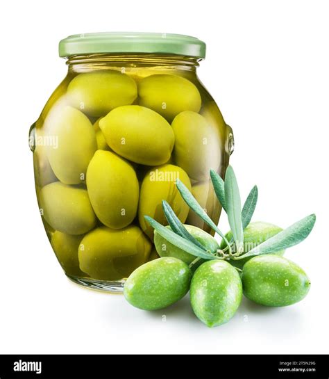 Whole green olives cured in brine in the glass can and raw olive ...