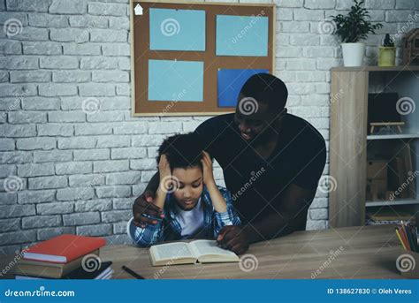 African American Single Father Helps Tired Son Stock Photo - Image of horizontal, education ...