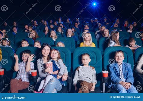 Audience of Movie Theatre Enjoying Film and Smiling. Stock Photo ...