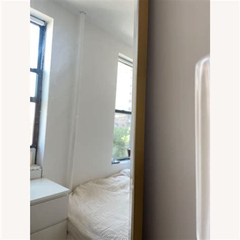 Crate & Barrel Brass Edge Arched Floor Mirror - AptDeco