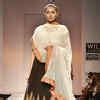 A model showcases a creation by designer Joy Mitra on Day 5 of the ...
