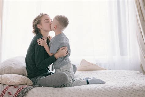 "Pretty Beautiful Family Mother And Son In Bed In The Morning" by ...