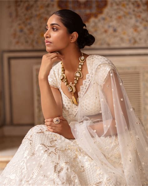 Buy Estella Ivory-Based Light Gold Lehenga Set With Sequins And Tassels