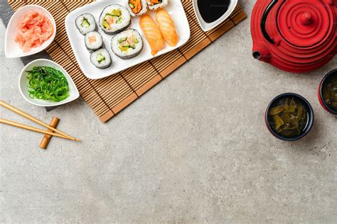 Japanese sushi with soy sauce, ginger and algae salad photo – Stone ...