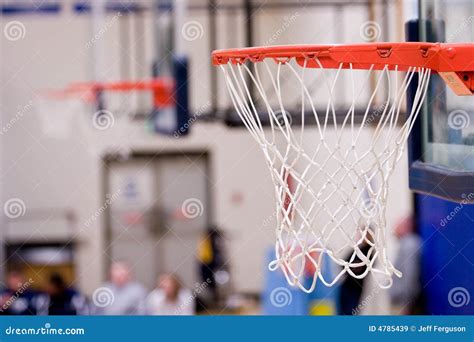 3 Basketball Hoops with Nets Hanging Inside a Gym Stock Image - Image ...