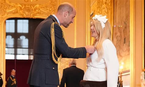 Ellie Goulding receives MBE at Windsor Castle for services to ...