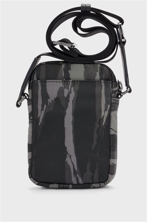 HUGO - Stacked-logo reporter bag with seasonal pattern - Black