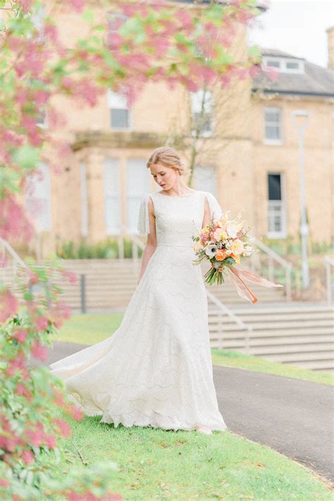 Carenza | Real bride in Dahlia lace & silk wedding gown: flutter sleeves, full skirt & deep V ...