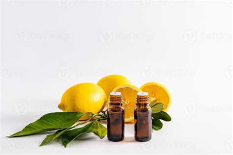 front view of two medical bottles with lemon essential oil opposite ...