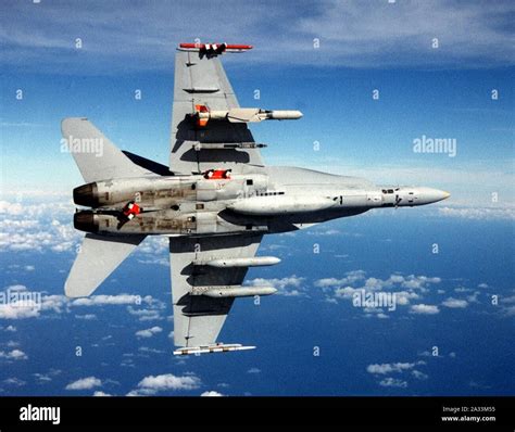 F-18C with SLAM-ER missile and AWW-13 pods in flight Stock Photo - Alamy