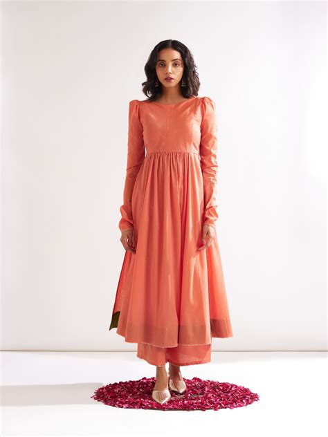 Pintucked yoke flared kurta with churidaar sleeves- Peach Fuzz