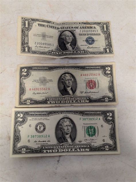 1935 silver dollar bill and (2) 2-dollar bills - Kaufman Realty & Auctions