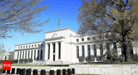 US Fed holds rates with eye on inflation - Times of India