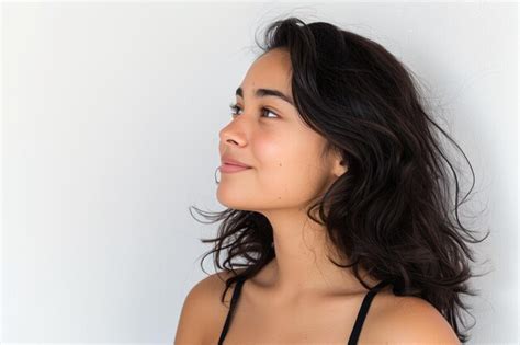 Profile view of girl looking out in white background | Premium Photo