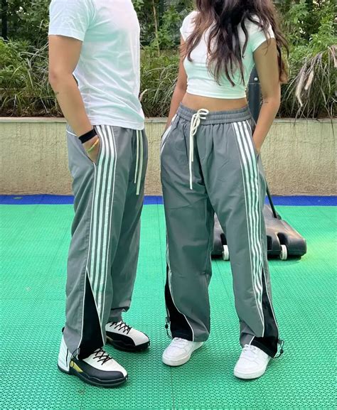 Striped straight fit parachute pants. | thebottomshub