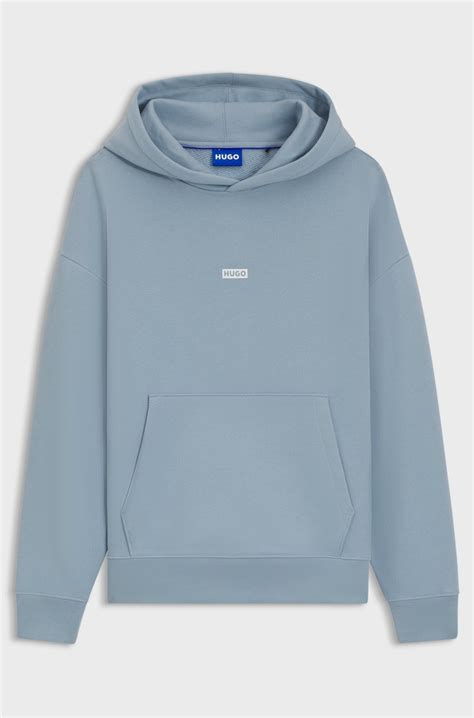 HUGO - Cotton-terry loose-fit hoodie with logo details - Light Blue