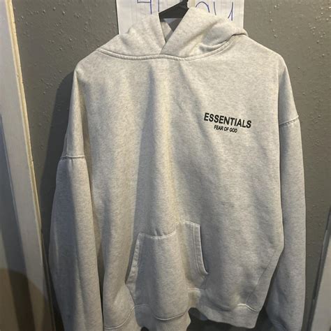 Grey Essentials Hoodie Everything being sold is... - Depop