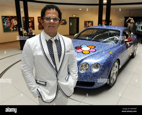 Brazilian artist Romero Britto stands in front of a Bentley Continental GT designed by himself ...