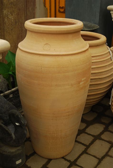 We have a variety of Greek terracotta pots. This tall elegant pot one ...