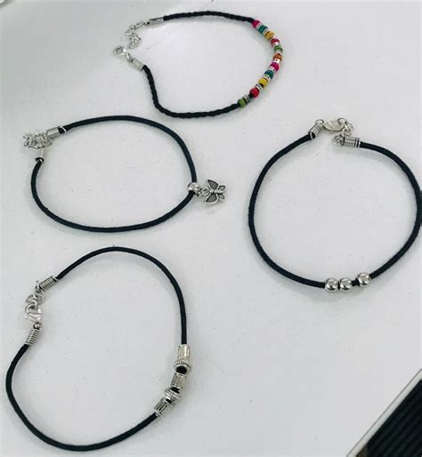 GURJARI JEWELLERS Girl's Lac and Brass Anklet (Black Thread) - Set of 4 ...