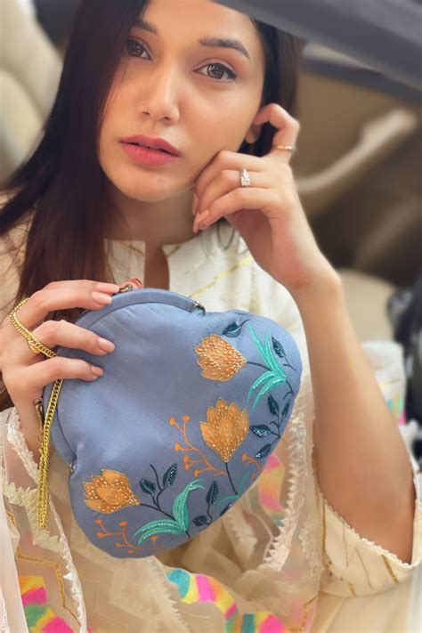 Buy Blue Embroidered Potli Bag by Anaya by Akruthi Online at Aza Fashions.