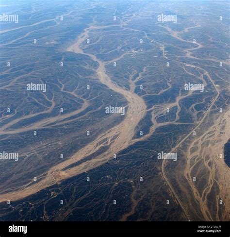 A Surreal aerial view of dried river beds in the desert in Jordan near ...