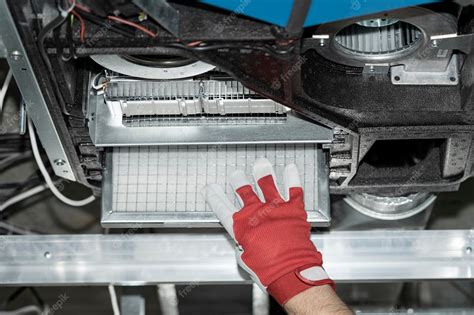 Premium Photo | Replacing the filter in the ventilation system ...