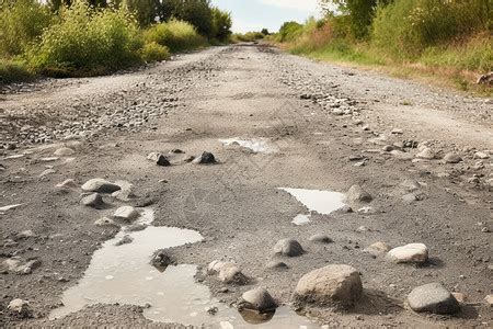 有大坑洞和泥水的公路春季肮脏的坑洼时间高清图片下载-正版图片307647185-摄图网