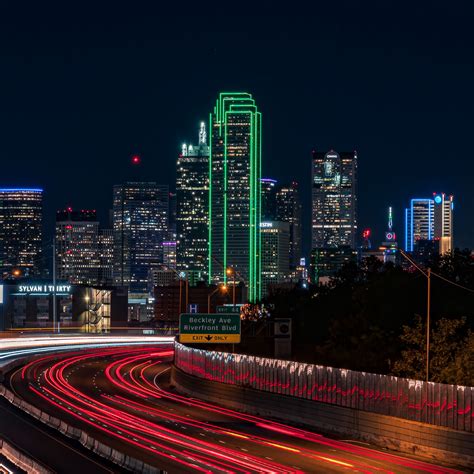 Download wallpaper 2780x2780 skyscrapers, neon, road, long exposure ...