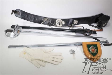 Regimental dress sword with "The Queen's Own Rifles of Canada" second battalion insignia, seen on bo