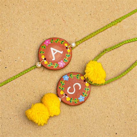 Buy Personalised Handcrafted Bhaiya-Bhabhi Initials Terracotta Rakhi ...