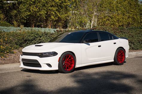 Stylish Warrior: White Dodge Charger with Black Roof and Red Wheels | CARiD.com Gallery