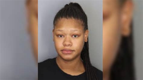 Woman accused of setting bed on fire while couple, baby sleeping