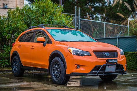 Orange Subaru Crosstrek in the Rain