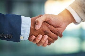 Corporate office and people with handshake for partnership or deal and ...