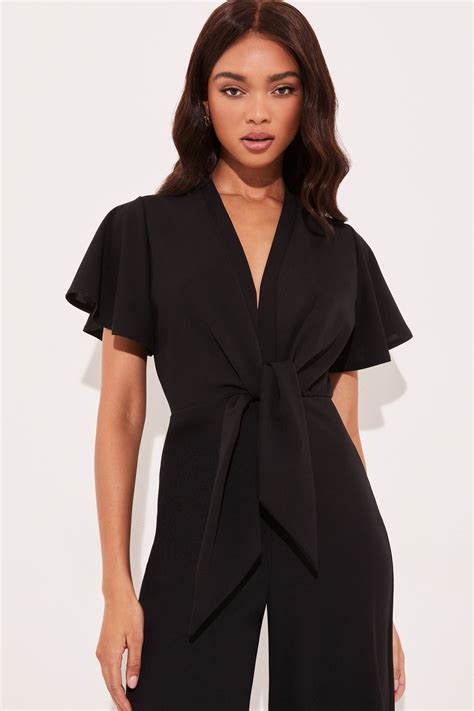Buy Lipsy Black Flutter Sleeve V Neck Tie Front Wide Leg Jumpsuit from ...
