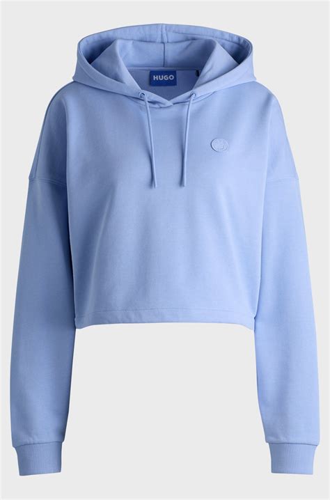 HUGO - Cropped cotton-terry hoodie with Happy HUGO logo badge - Light Blue