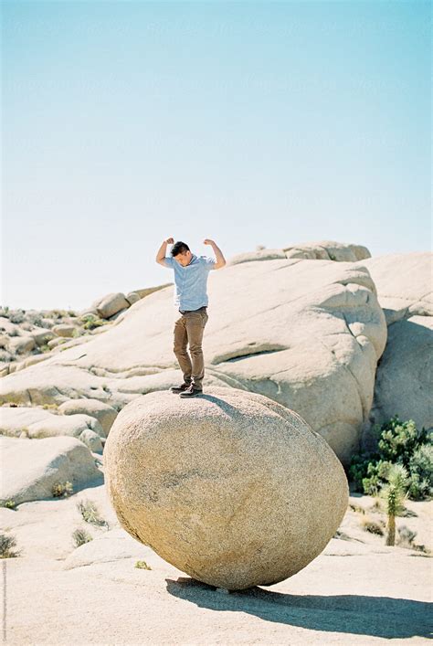 "Man Standing On Large Rock" by Stocksy Contributor "Daniel Kim ...