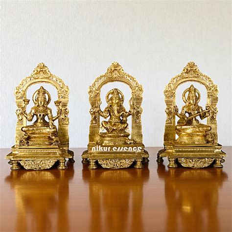 Goddess Lakshmi Ganesha Saraswati Seated on throne kirtimukha with ...