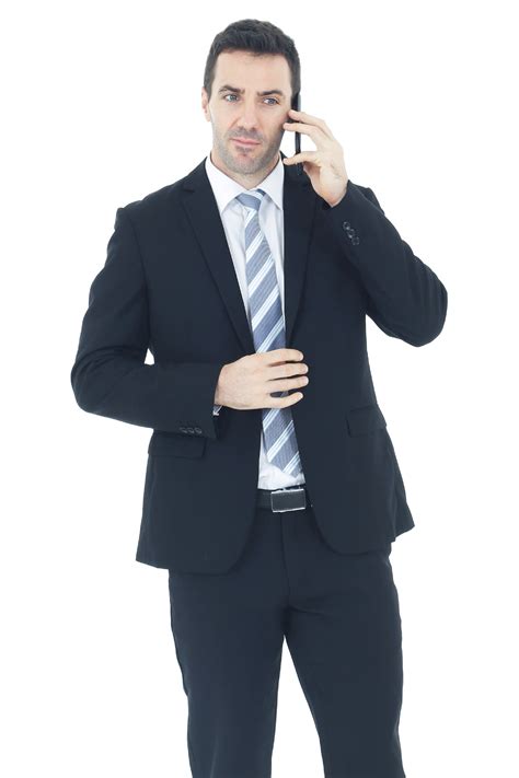 Handsome businessman in a suit hand holding smartphone and talking on ...