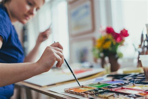 Female artist painting in art studio - Stock Photo - Dissolve