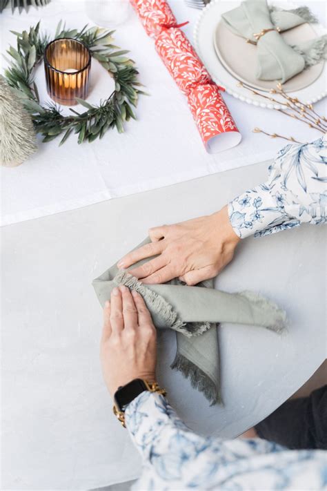 Christmas napkin folding technique: Fold your napkins into a bow