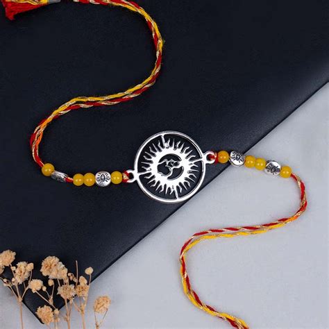 Send Pure Silver Om Rakhi with Roli Chawal Online - RKH23-110949 ...