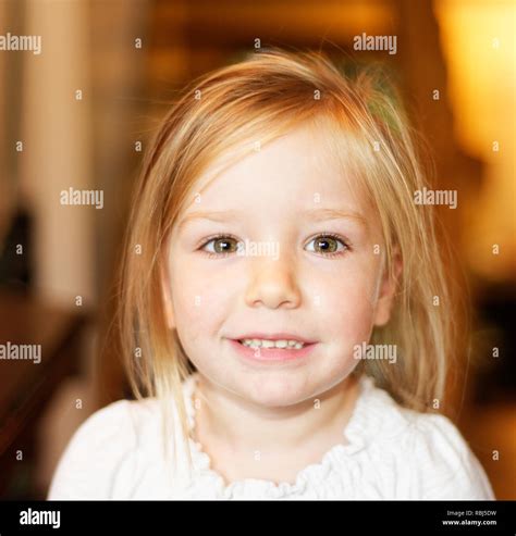 A portrait of a beautiful smiling four year old girl Stock Photo - Alamy