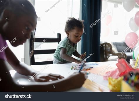 0 African Tween Girl Drawing On Table Girl Drawing On Table Royalty ...
