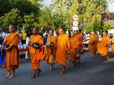 Thai Buddhist monks receive food offerings on Visakha Bucha Day in ...
