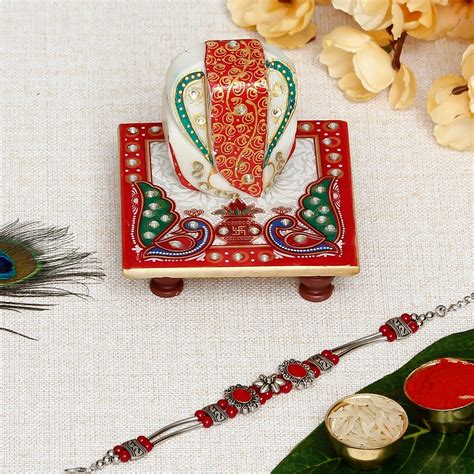 Designer Stone Rakhi with Lord Ganesha on Marble Chowki and Roli Chawal ...